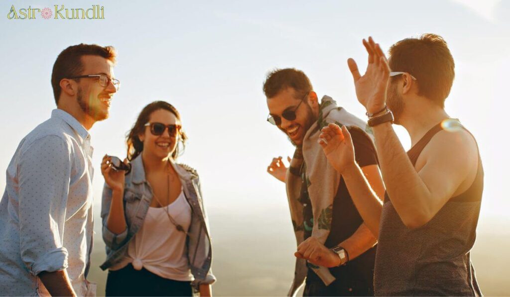 4 friends laughing and dancing